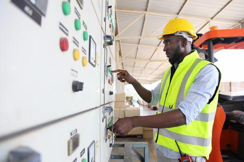 Engineer is checking for power at main distribution board for the circuit at the factory site electricity maintenance